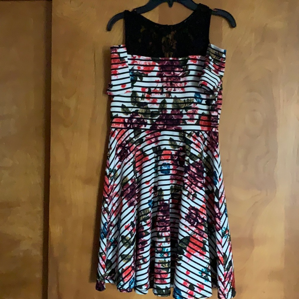 Floral girls dress size 14. Flowers with black strips.